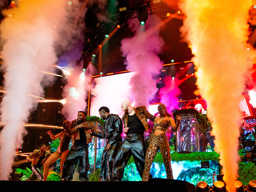 Jason Derulo wide shot with smoke and dancers.